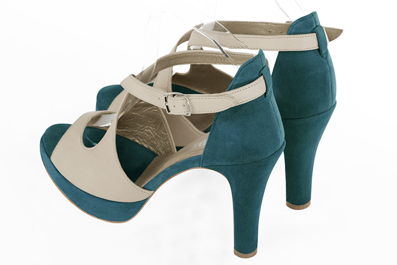 Champagne white and peacock blue women's closed back sandals, with crossed straps. Round toe. Very high slim heel with a platform at the front. Rear view - Florence KOOIJMAN